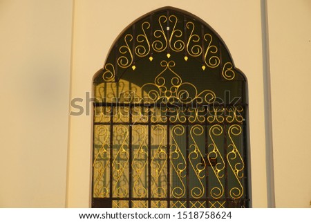 Gold and black grille door at Islamic building 