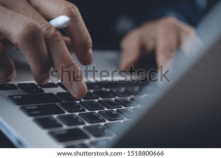 Business, internet technology, social network concept. Close up of business man, graphic designer hand working, typing on laptop computer, digital tablet on desk, connecting internet in office