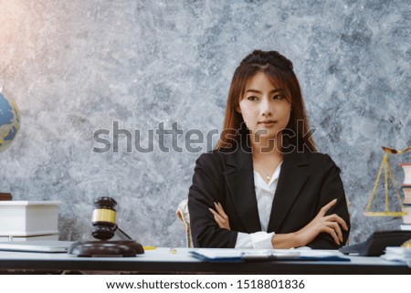 Beautiful young lawyer woman working in office. Legal law, advice and justice concept.