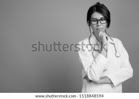 Portrait of young woman doctor shot in black and white