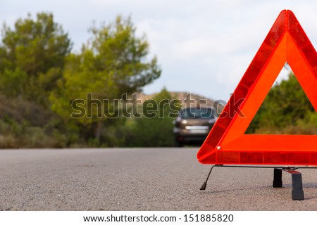 Vehicle with problems and a warning triangle