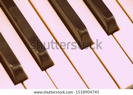 Old vintage piano brown color close-up. Retro style