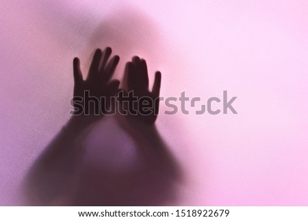 silhouette of a mysterious hand with red tone
