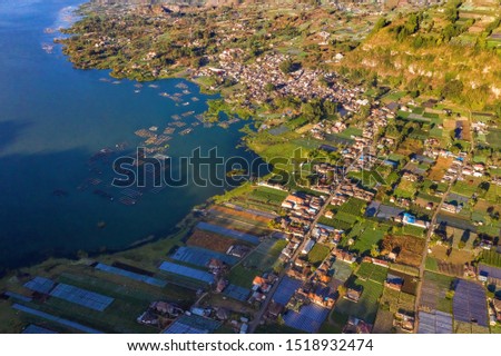 Aerial view of village at Indonesian volcano Batur in the tropical island Bali. Royalty high quality free stock image of Danau Batur, Indonesia.