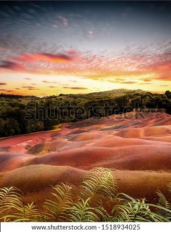seven colored earth in Mauritius is a tourist place that is unique.  Duch lava was created here in 7 colors.  which you sat here in a great picture