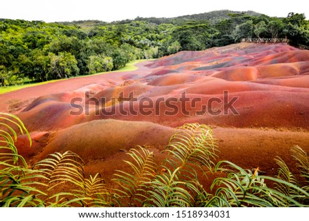 seven colored earth in Mauritius is a tourist place that is unique.  Duch lava was created here in 7 colors.  which you sat here in a great picture