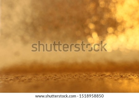 background of gold glitter lights. de focused