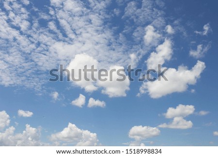 Bright blue sky with white clouds for background or wallpapers.The beauty of tropical nature for graphic design