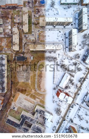 Aerial drone shot of a half frame
autumn and half frame winter city