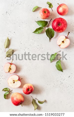 Ripe Red Apples with Leaves, Textured Concrete Background, copy space for your text