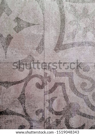 gray ceramic tiles with geometric and floral patterns
