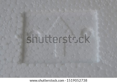 Square sign arrow on white styrofoam.