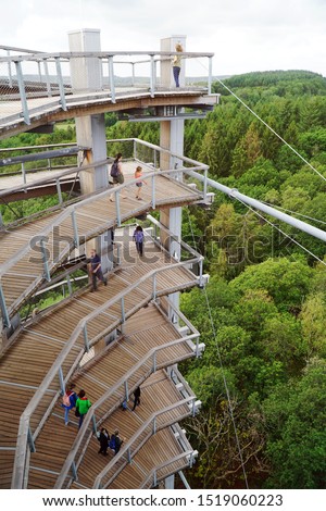 Lookout tower of the treetop path called Baumwipfelpfad directly on the Saarschleife in Saarland, Germany                        Royalty-Free Stock Photo #1519060223