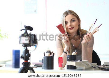 Famous Makeup Product Review Video Blog Concept. Beautiful Vlogger Recording Beauty Tutorial. Cosmetics, Tools Selection Advice from Female Blogger. Online Translation at Home or Studio
