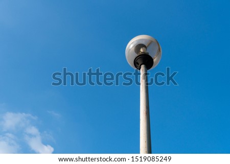 Lighting of public park and streets with blue sky, copy space.