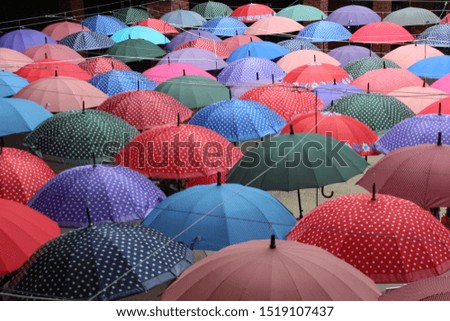 Bright colorful hundreds of umbrellas floating above the streetю Baku Azerbaijan 