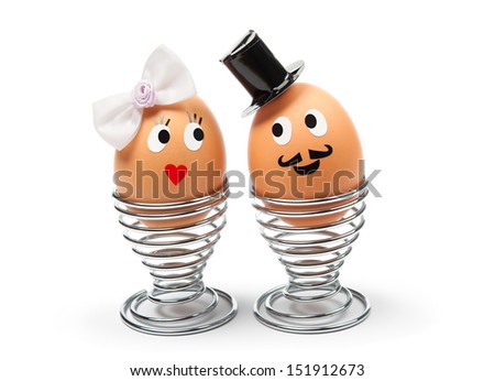 Two funny cheerful eggs - groom and  bride