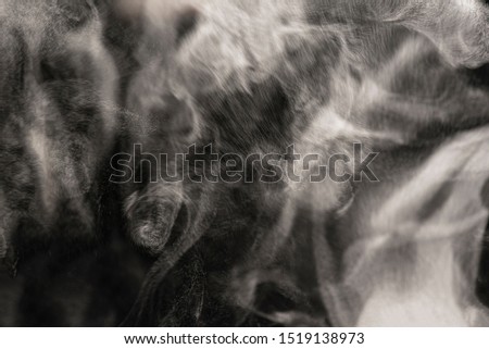 steam or smoke on black background
