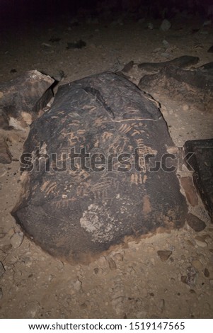 Night view of a drawing carved in stone by a primitive man in the desert in southern Israel near the Avdat fortress