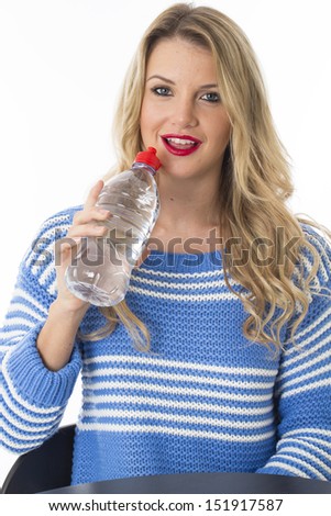 Attractive Fit Young Blonde Caucasian Woman Drinking From A Plastic Bottle Of Fresh Hydrating Still Mineral Water, Isolated On White, Alone