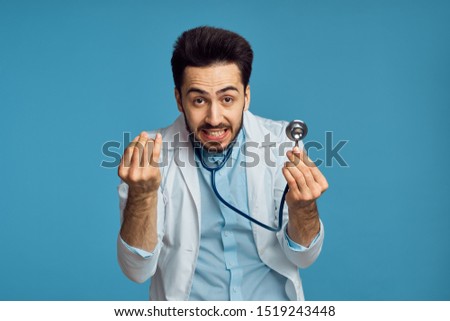  stylish doctor man looking at the camera in anger                              