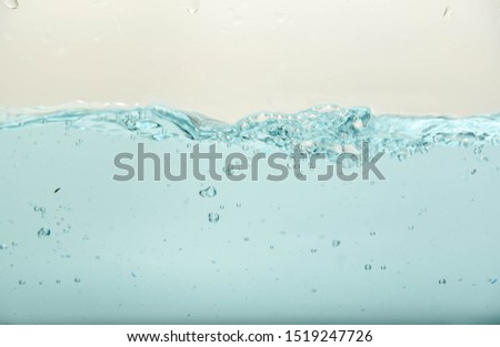 Blue water splash and air bubbles isolate on white background/Clean and clear water