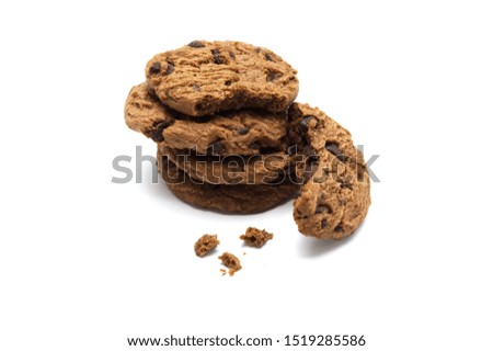 Pile of Chocolate chip cookies and crumbs on white background.