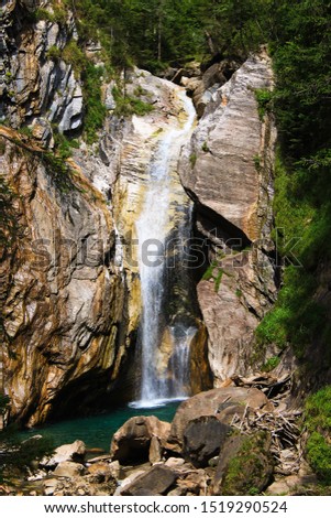Waterfall in Austria. Famous tourist attractions and landmarks destination, Europe nature landscape. Blue water, green nature and nice weather