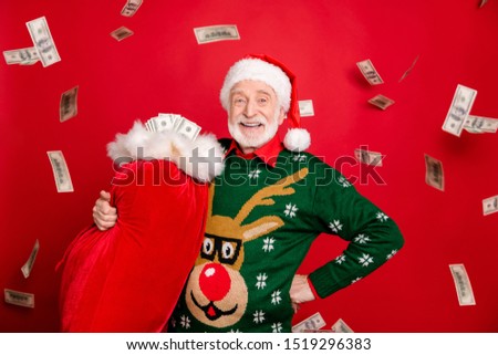 Gifts debit credit bank! Portrait of grey white hair beard old man pensioner retired rich santa claus hold bag finance deliver people in x-mas wear antler design sweater isolated red color background