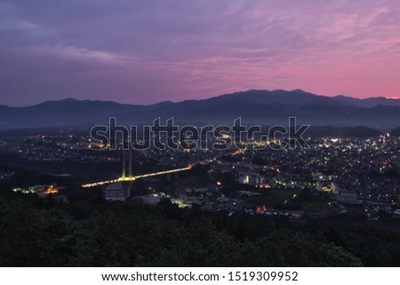 At just before sunrise, morning glow　and night view of Chichibu city from The Chichibu Muse Park in Saitama Prefecture, Japan. Sep. 28, 2019.