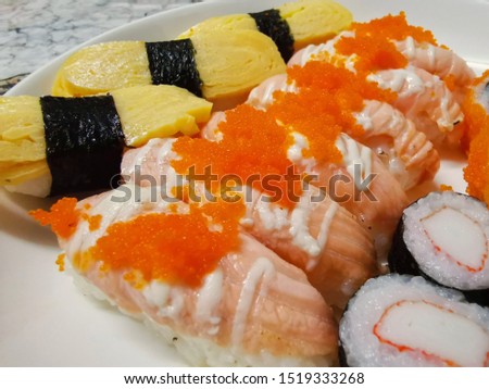 Mixed Sushi set on dish in Japanese Restaurant Served ready to eat Health Food concept