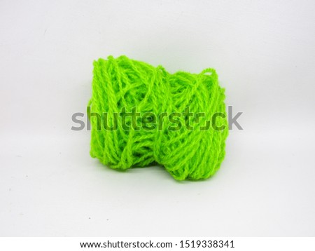 Benang wol rajut or roll knitting wool yarn in various colorful multi colored dye. Made from  natural or synthetic fibers. Detail texture pattern close up view microfiber ball loop waves shape fabric.