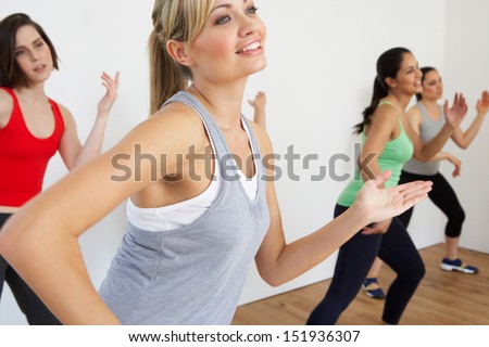Group Of Women Exercising In Dance Studio