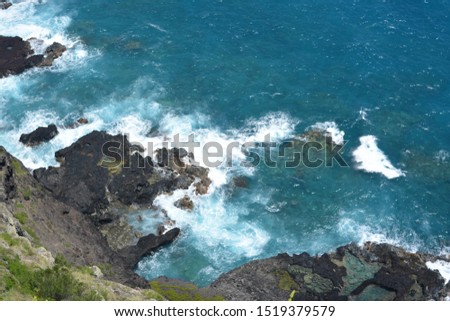 Spectacular view of Rocky coast and Turquoise water crashing onto the mountain from Makapuu Point Lighthouse Trail on the Western tip of Oahu island in Hawaii