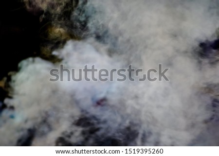 Blurred white smoke on a black background Smoke surface