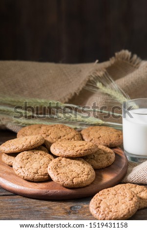 Oatmeal cookies on a wooden round Board. Rustic style. Top view