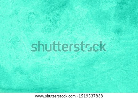 Mint marble texture. Natural patterned stone for background, copy space and design. Abstract marble stone surface. Trendy color. Tones of biscay green color.