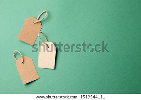 Cardboard tags with space for text on green background