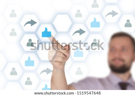 Young business man touch hex schema of social network with icons of like share and users. 