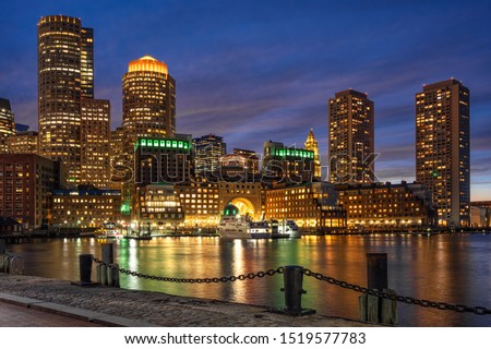 Scene of Boston skyline from Fan Pier at the fantastic twilight time with smooth water river, Massachusetts, USA downtown skyline, Architecture and building with tourist concept Royalty-Free Stock Photo #1519577783