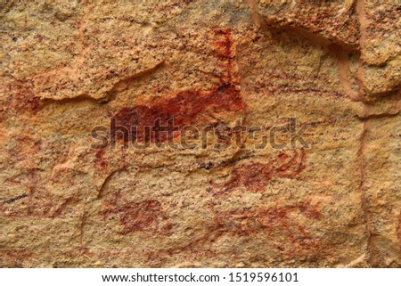 Rock painting in the region of "Serra da Capivara" - State of Piaui - Northeast Brazil. The picture seems to depict a deer among other animals.
