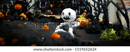 Voodoo white thread doll and pumpkin head in dark night horror scene with black castle DIY handmade design for decoration display on Happy Halloween party event October day horizontal banner style