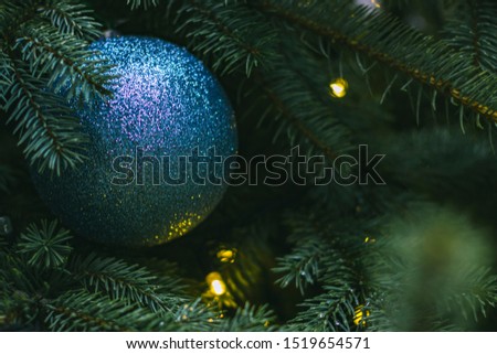 blue Christmas tree toy spruce needle branches winter holidays decoration season concept moody atmospheric picture  