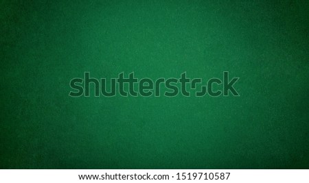 Poker table felt background in green color Royalty-Free Stock Photo #1519710587