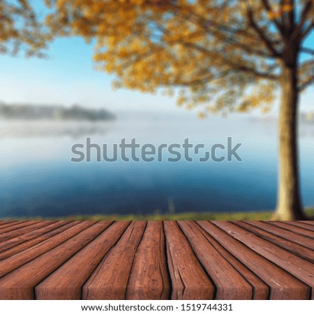 Empty wooden table with autumn background.
