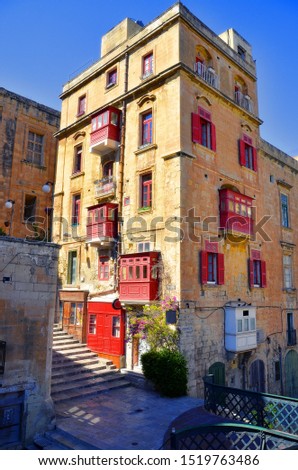 The building with an interesting red balconies, Valetta, Malta.