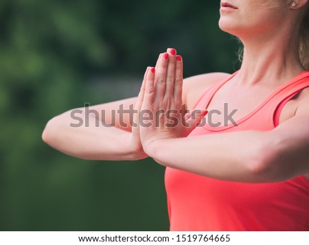Woman in her Thirties Doing Yoga in the Park Closeup