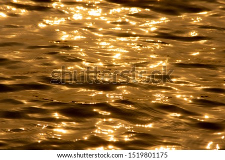 blurry yellow-orange image from sea water as  a background