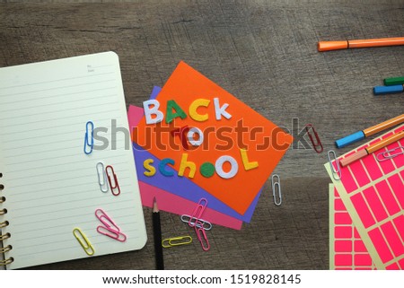 The concept of Back to School with a set of school stationery on a wooden table