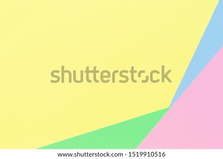 Abstract geometric paper background in light pastel yellow, blue, green, pink color tones